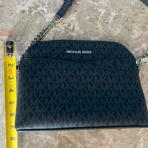 Blue Michael Kors crossbody bag with silver hardware.